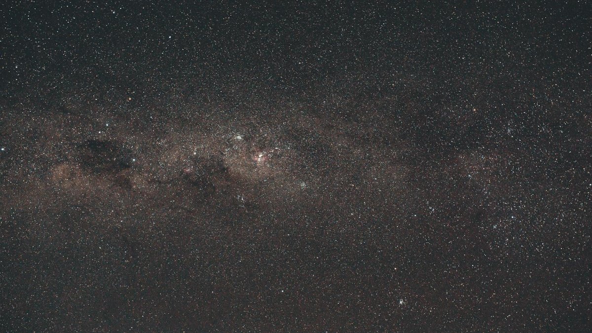 A breathtaking night sky showcasing countless stars and distant nebulae, perfect for space enthusiasts.