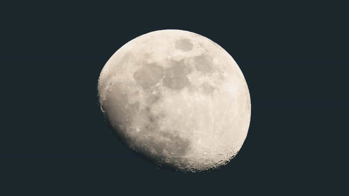 Captivating view of a waxing gibbous moon over Darien, Connecticut, showcasing lunar details against a dark sky.