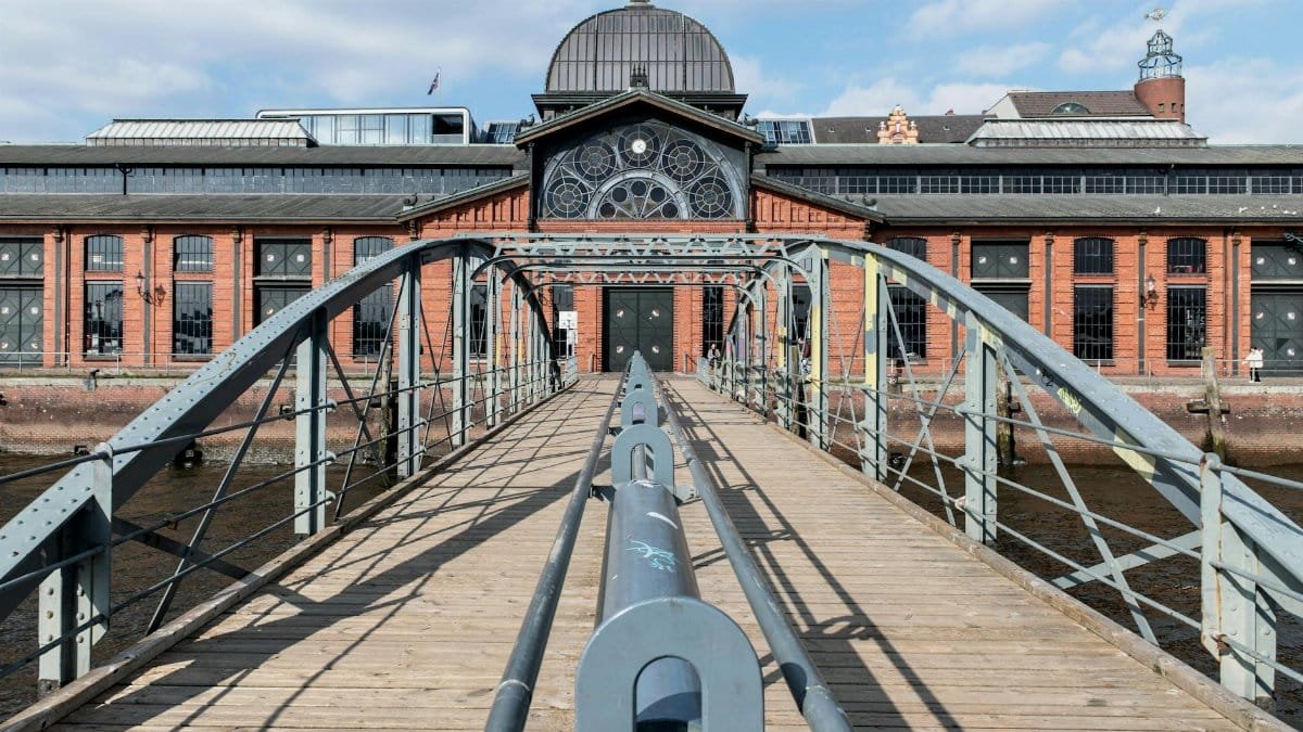Historic fish auction hall in Hamburg captured from a bridge during daytime.