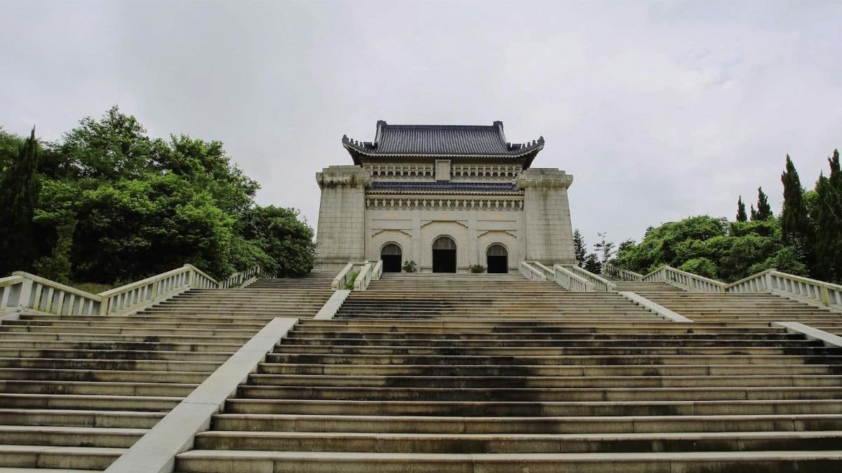 Majestic view of Dr. Sun Yat-sen's Mausoleum surrounded by greenery in Nanjing.
