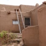 Traditional adobe architecture in Taos Pueblo, New Mexico showcasing rustic charm.
