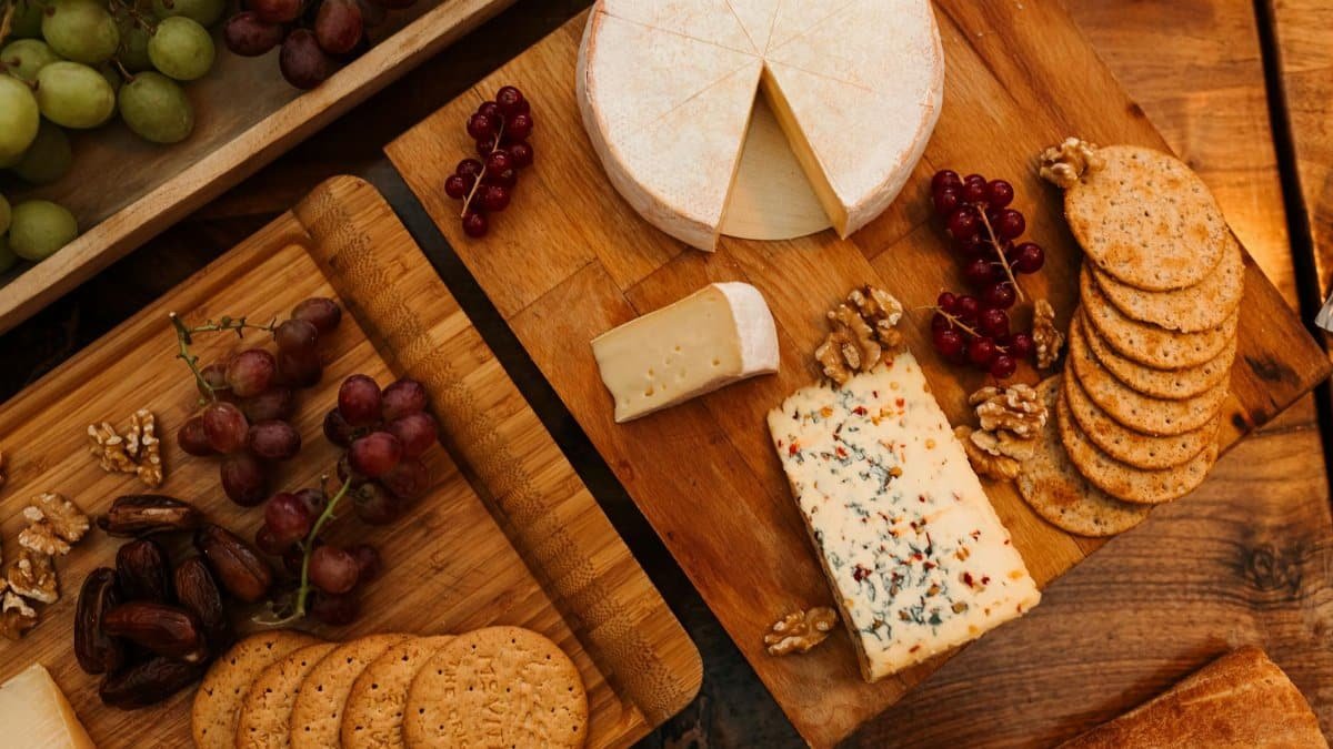 A beautifully arranged cheese board with fruits and nuts in Liseleje, Denmark, perfect for celebrations.