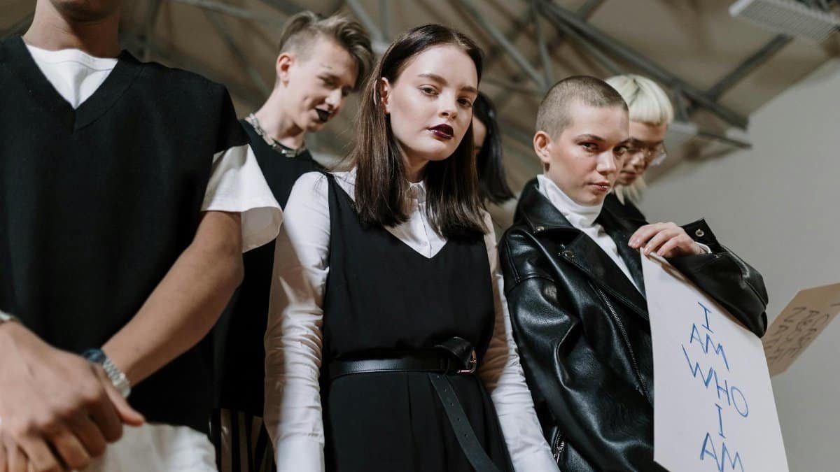 A diverse group of Gen Z individuals showcasing unique style and fashion indoors.