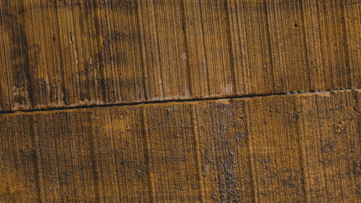 Closeup of aged wooden planks showcasing natural weathered texture and rustic appearance.