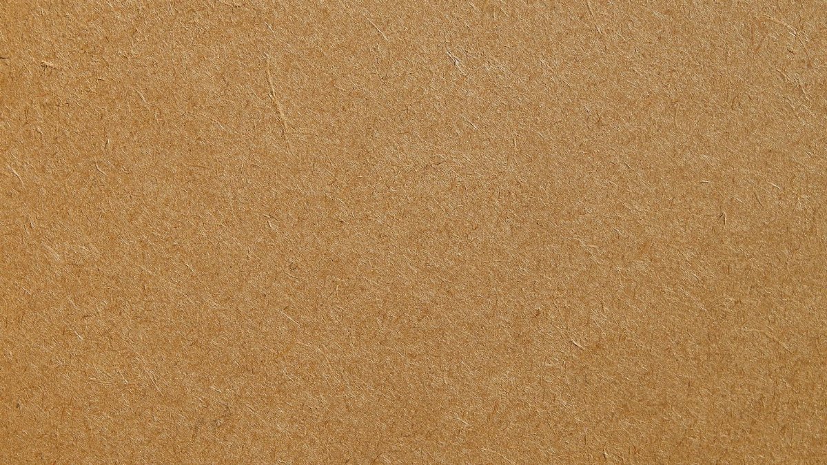 Detailed texture of a brown cardboard surface, ideal for backgrounds and design projects.