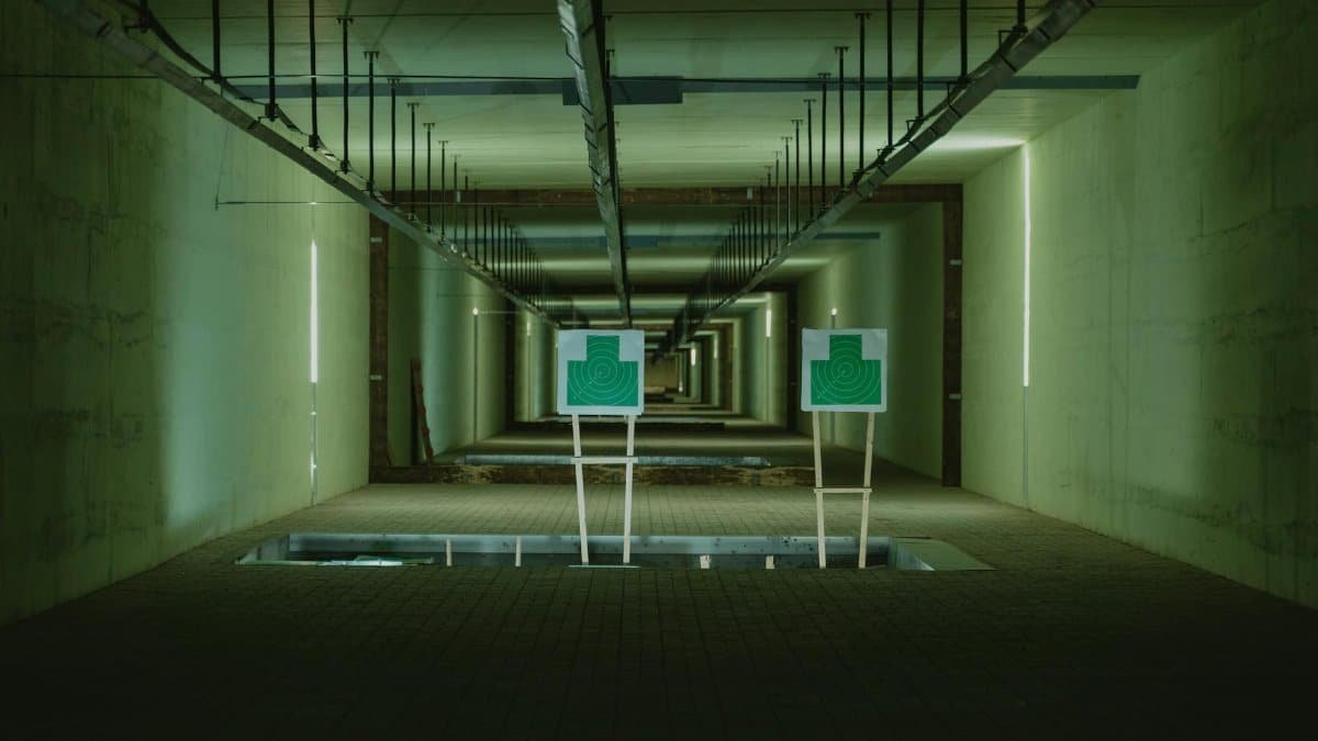 Perspective view of shooting range with two green targets indoors