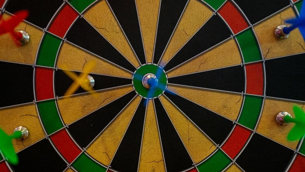 Close-up of a vibrant dartboard with darts highlighting accuracy and precision.