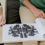 A close-up of a Rorschach inkblot test during a psychotherapy session, highlighting mental health care.