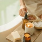 Calm spa setting with lit candles and bath products for a soothing atmosphere.