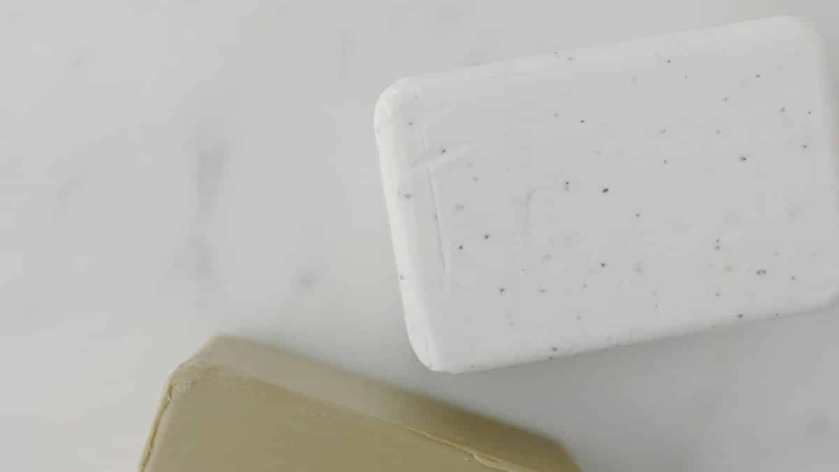 Elegant overhead shot of two soap bars on marble, perfect for skincare and hygiene themes.