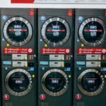 A row of modern washing machines in a public laundromat in Chiang Mai, Thailand.
