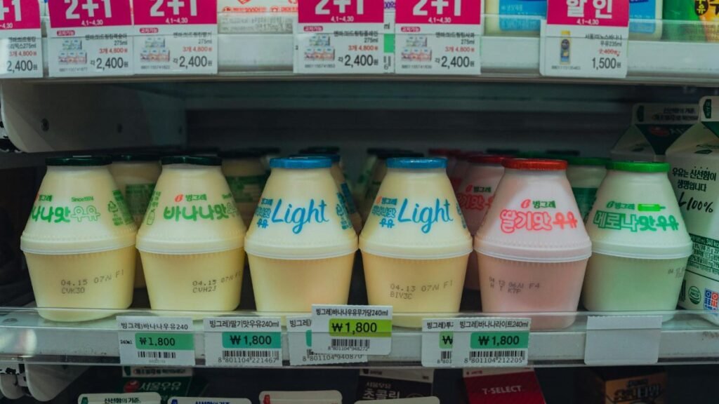 Vibrant assortment of Korean drinks in a convenience store fridge in Seoul, South Korea.