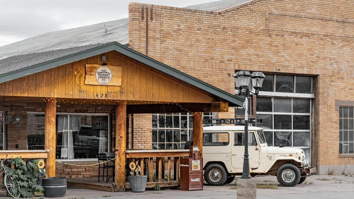 Explore a vintage cafe experience along Route 66 in Williams, Arizona featuring classic decor and a retro vehicle.