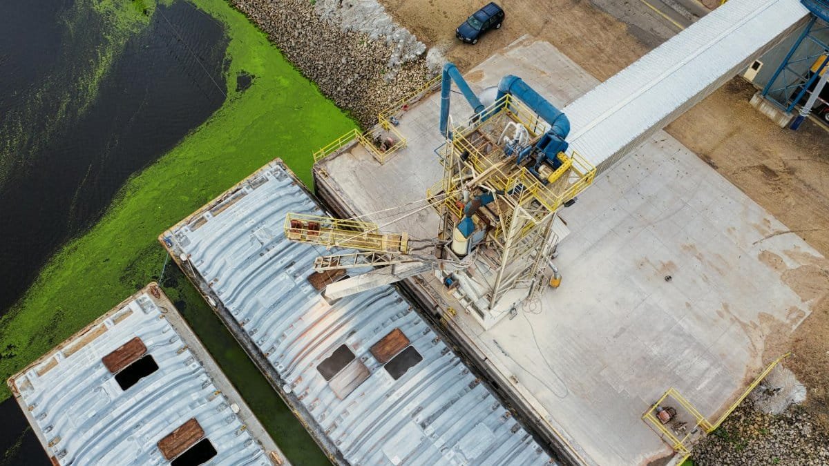 An aerial shot of a loading station with barges near a lake in Winona, Minnesota.