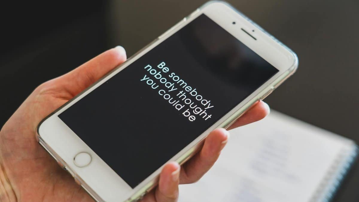 Close-up view of a smartphone displaying an inspirational quote, perfect for motivation and technology concepts.