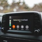 Screen of modern multimedia system in car with hand free call to home