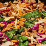 Colorful stir-fry of beef and mixed vegetables in a pan, showcasing fresh ingredients.