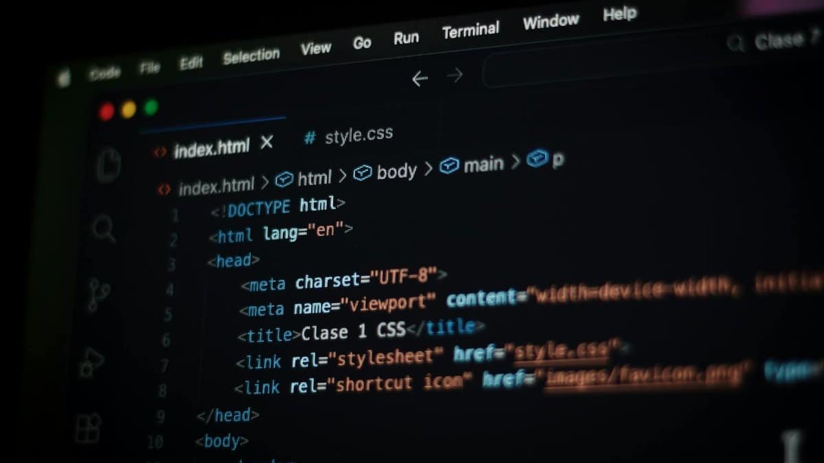 Close-up of HTML code displayed on a computer screen in dark mode, focusing on programming concepts.