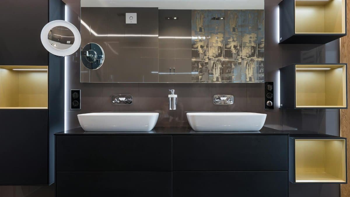 Sleek modern bathroom featuring a double sink vanity, stylish cabinets, and a large mirror.