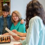 Family bond strengthened through chess at home, featuring multiple generations.