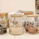 Glass jars with organic snacks on a counter in an eco-friendly zero waste store.