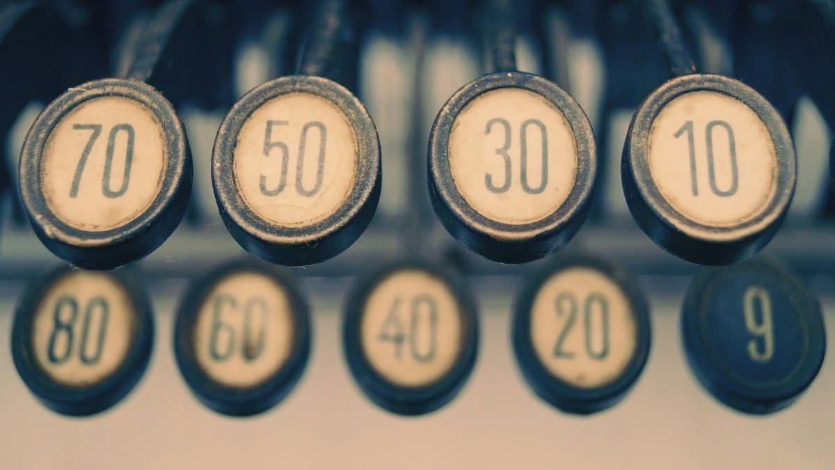 Close-up of a vintage typewriter showcasing numbered keys with a retro feel.