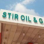 Close-up of Stir Oil & Gas sign at a filling station in Ikorodu, Nigeria under bright sky.