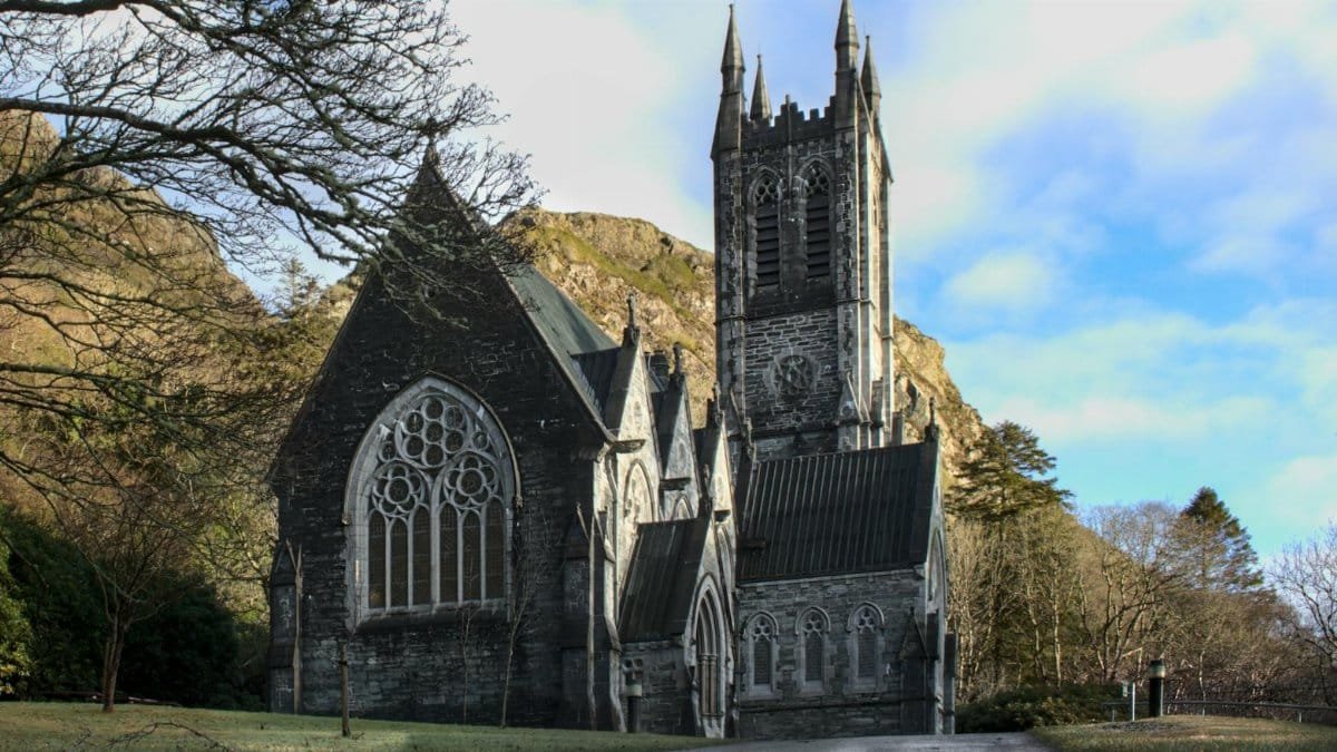 Stunning Gothic Revival architecture in a serene landscape, Letterfrack, Ireland.