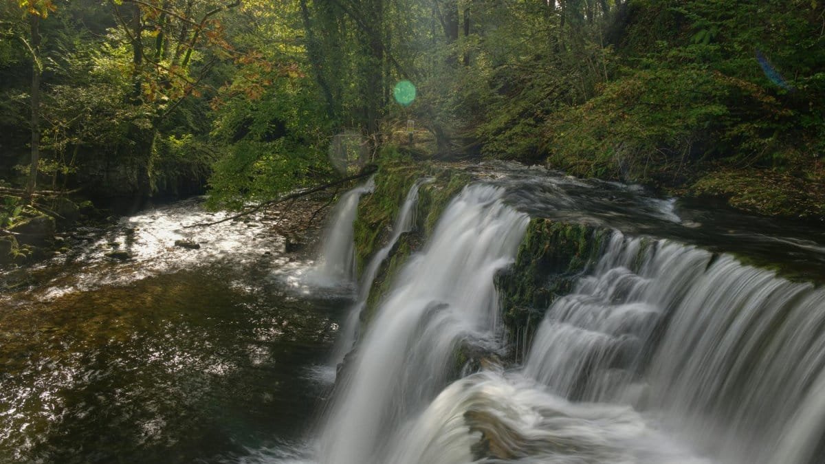 Scenic waterfall in Brecon Beacons National Park, Wales, during autumn.