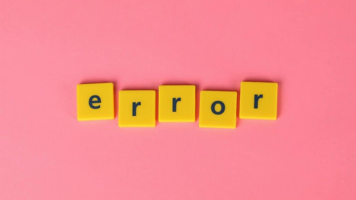 Yellow block letters spelling 'error' on a vibrant pink background, capturing a playful message.