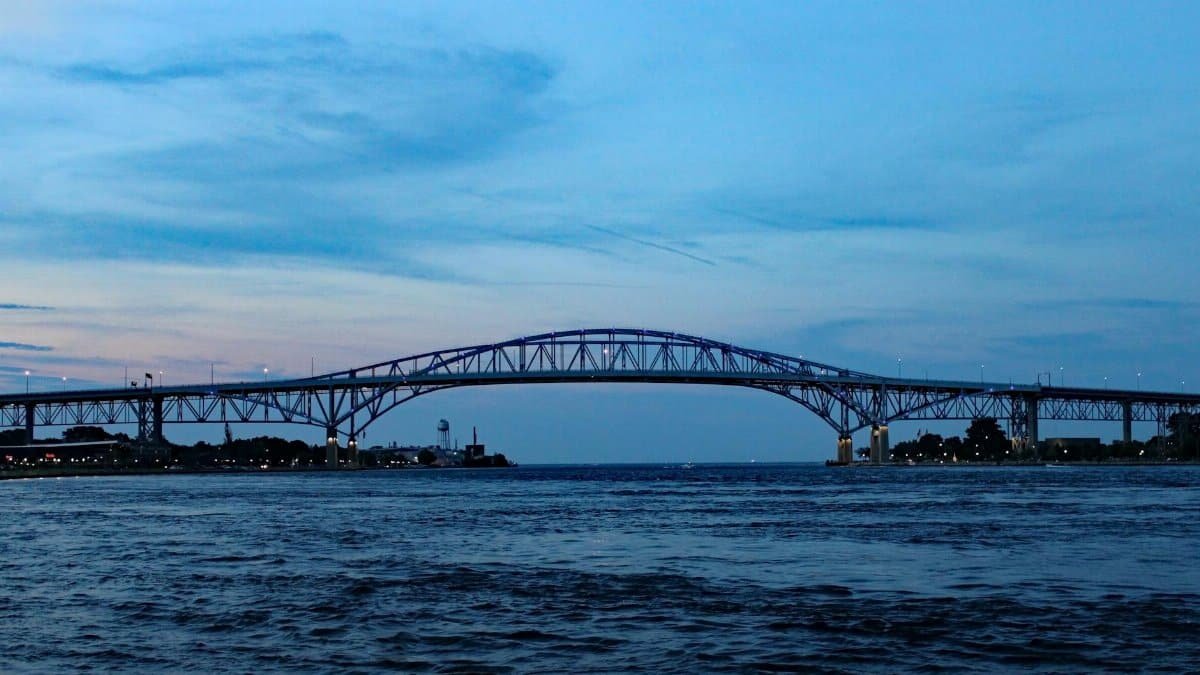 Scenic view of the Blue Water Bridge spanning the St. Clair River at twilight in Port Huron, Michigan.