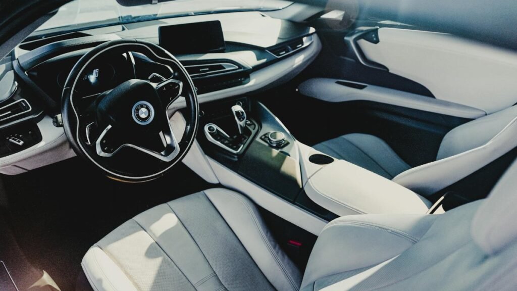 Explore the sophisticated interior of a BMW i8 sports car featuring sleek design and premium materials.