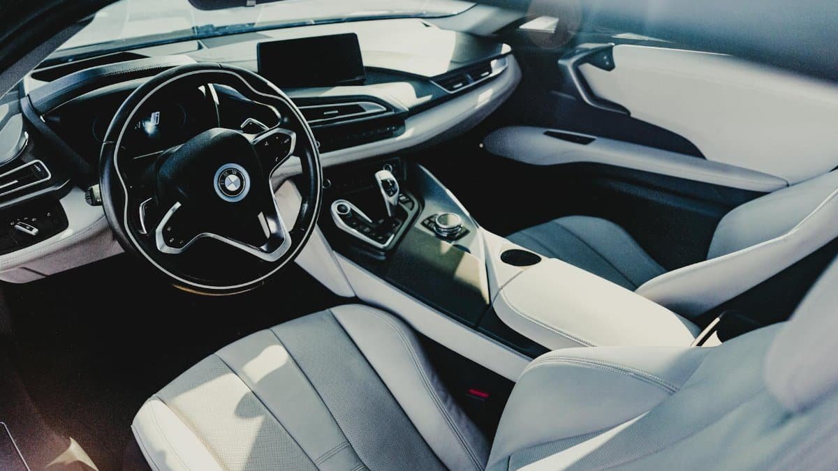 Explore the sophisticated interior of a BMW i8 sports car featuring sleek design and premium materials.