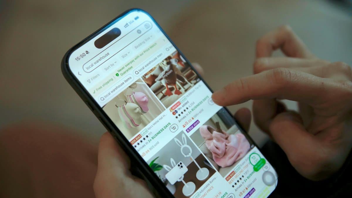 Person browsing shopping app on smartphone, displaying modern ecommerce interface.