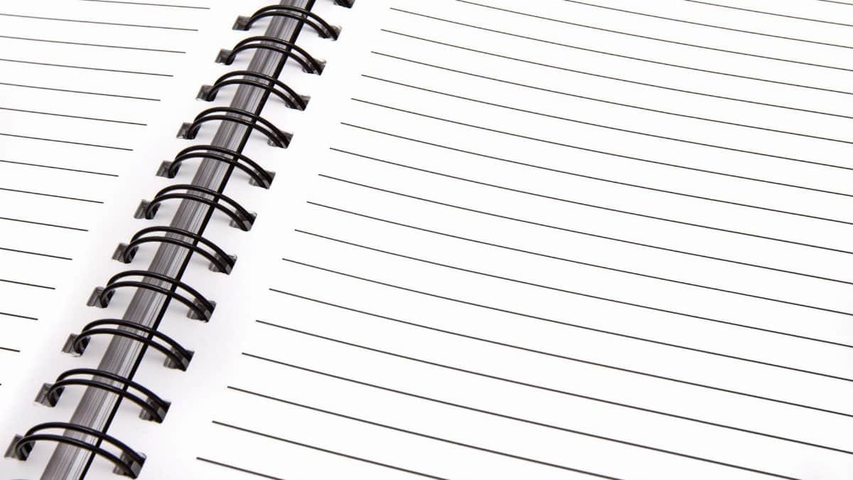 Open spiral notebook with lined pages, perfect for notes and planning.