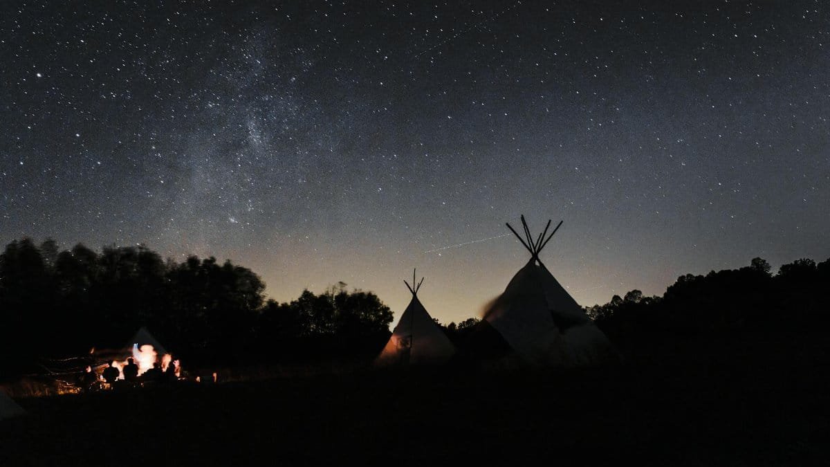 Starry night view of teepee camp in North Carolina, perfect for nature and stargazing enthusiasts.