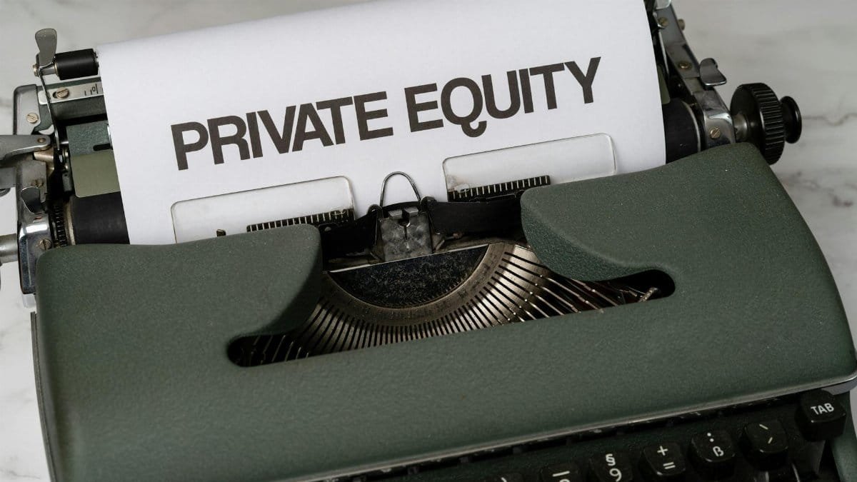 Close-up of vintage typewriter with 'PRIVATE EQUITY' on paper, business concept.
