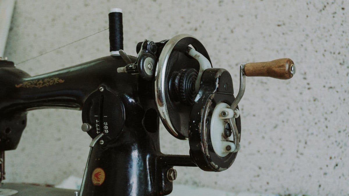 Close-up of an antique sewing machine in Oghuz, Azerbaijan, showcasing detailed craftsmanship.