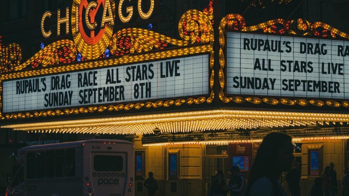 Chicago Theatre marquee at night advertising a live show.