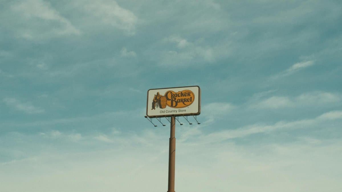 Cracker Barrel signpost with a clear blue sky background in Valdosta, GA, USA.