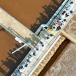 Aerial view of people touring an industrial water treatment facility in Langfang, China.