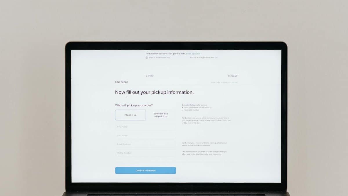 A laptop displaying an online checkout form, highlighting technology and e-commerce.