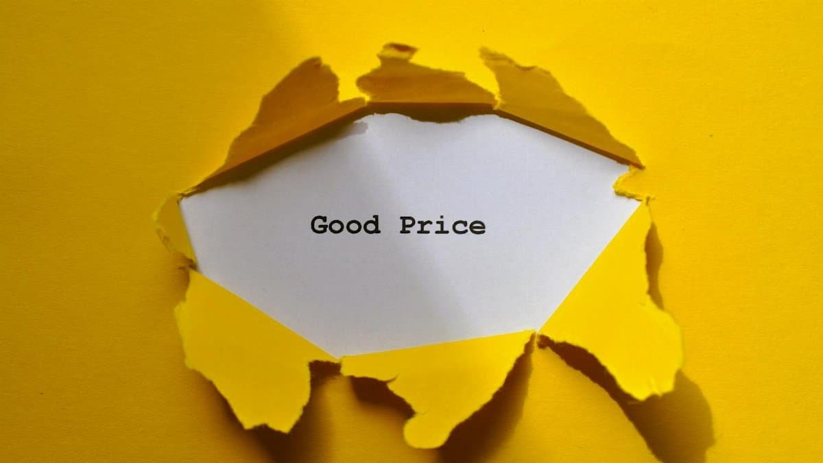 Yellow torn paper revealing 'Good Price' text, perfect for sales and marketing themes.