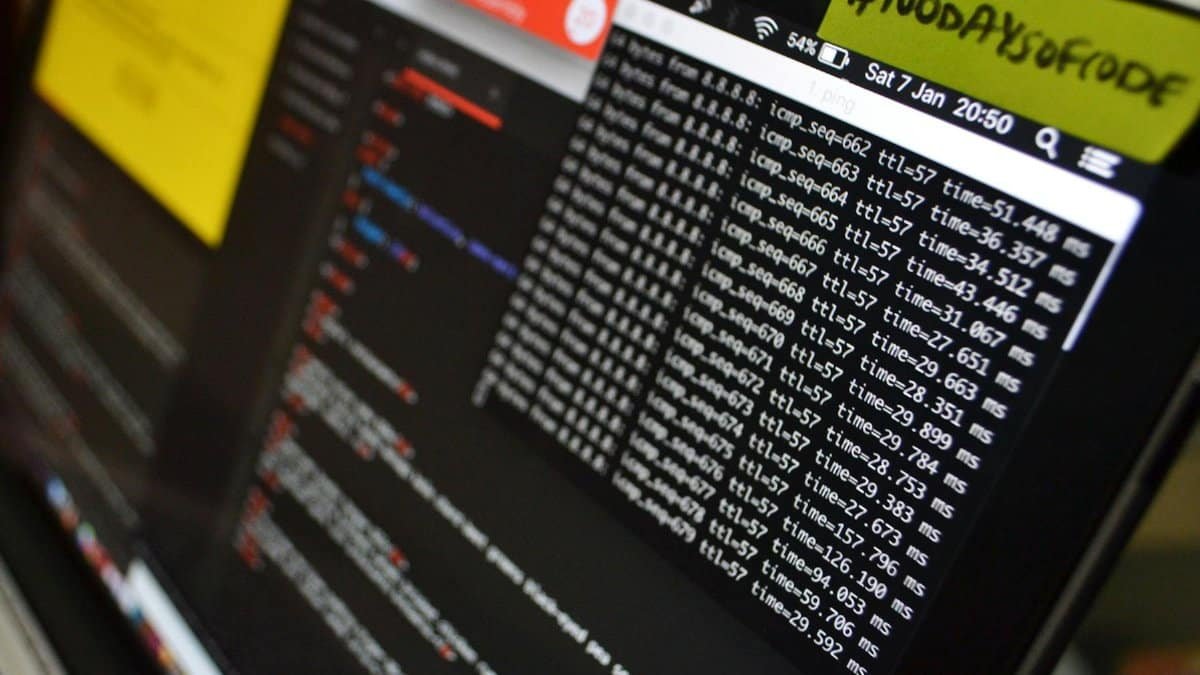 Macro shot of a laptop displaying coding and data analysis in progress. Ideal for tech themes.