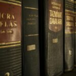 Detailed close-up of law and regulation books on a bookshelf, emphasizing education and knowledge.