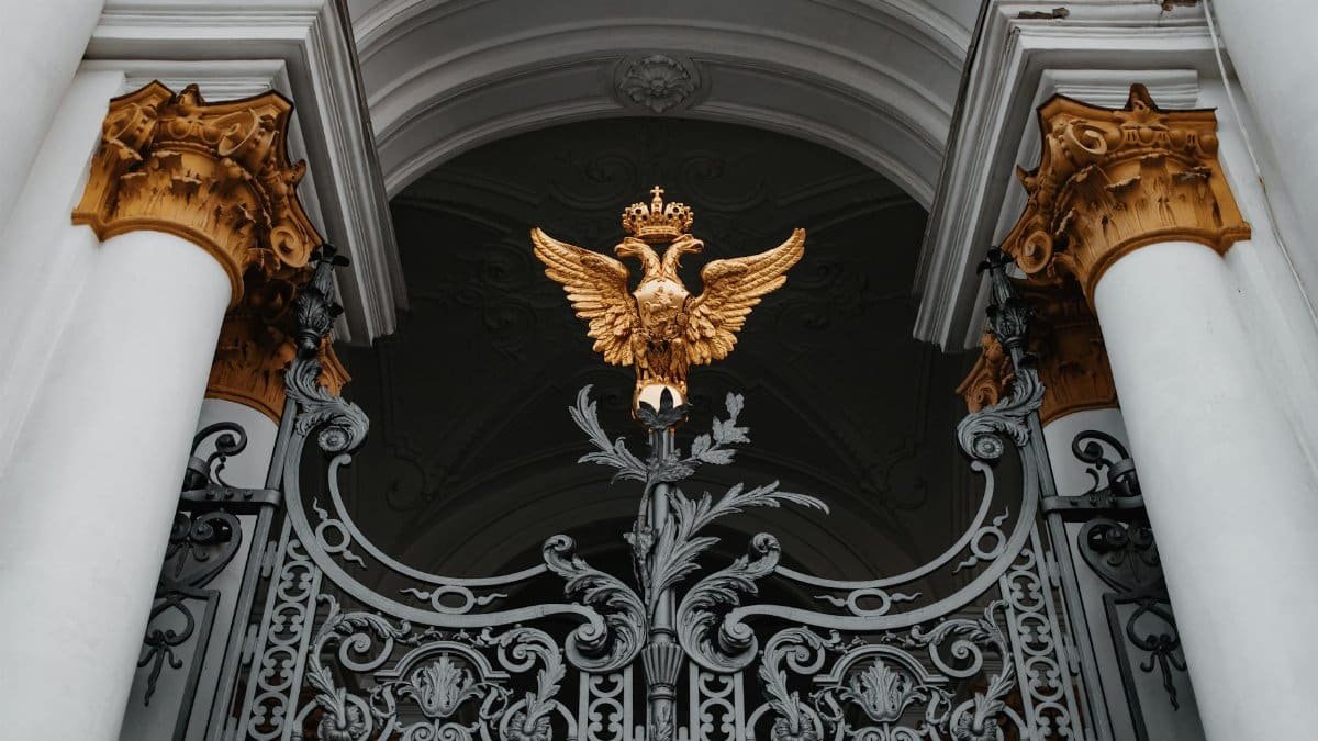 Intricate gate with a golden double-headed eagle at the Winter Palace, Saint Petersburg, Russia.