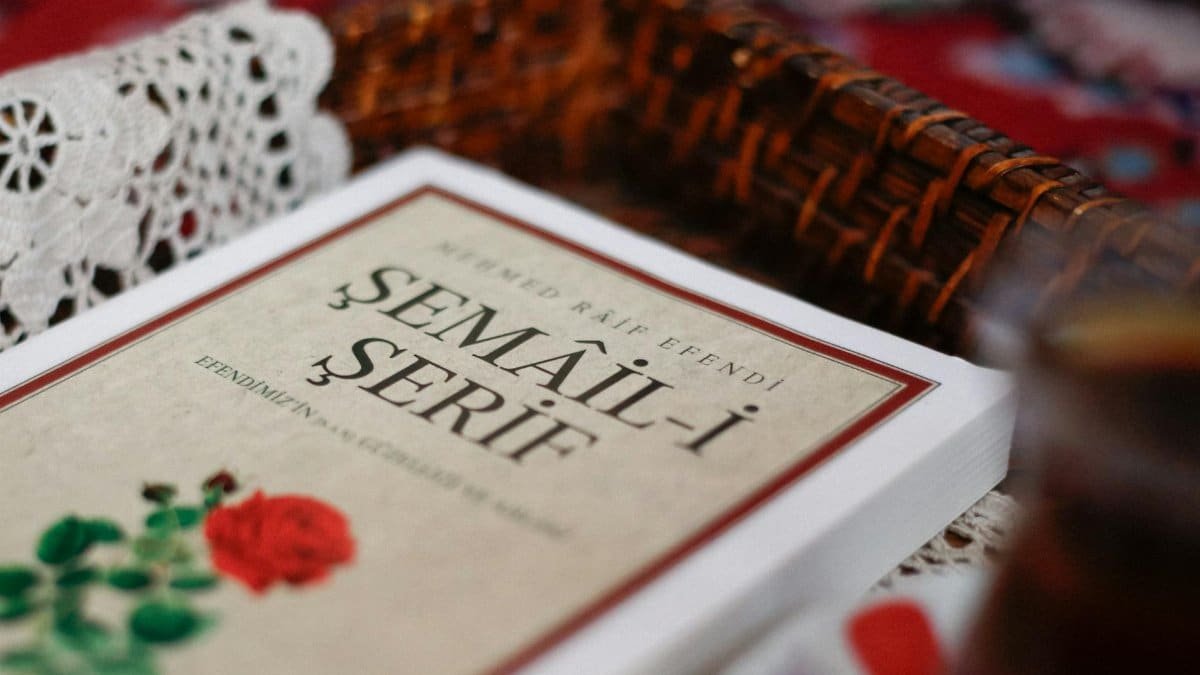 Close-up of the Semail-i Serif book with a woven basket and lace in the background.