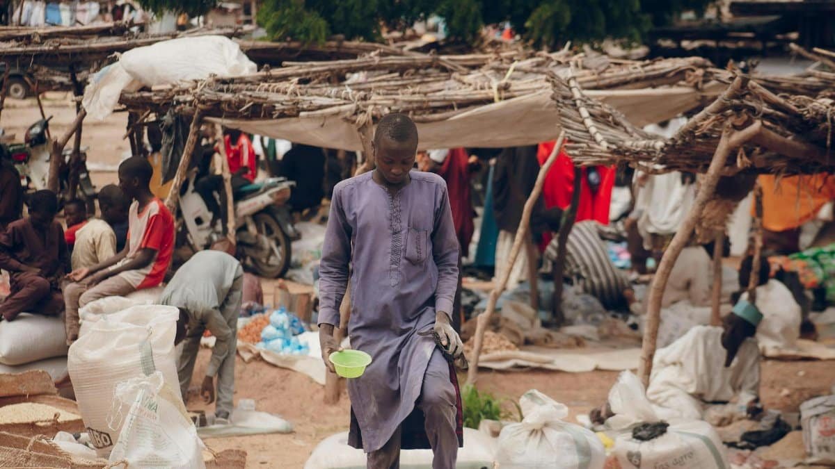An African market scene with vendors and goods, capturing daily life and community.
