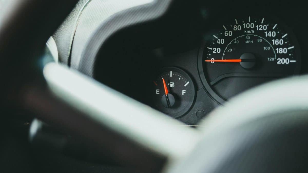 A detailed view of a car's dashboard showing the speedometer and fuel gauge indicators.