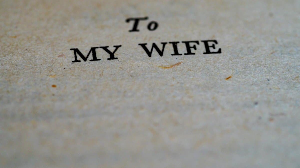 Close-up image of the dedication 'To My Wife' on textured paper.